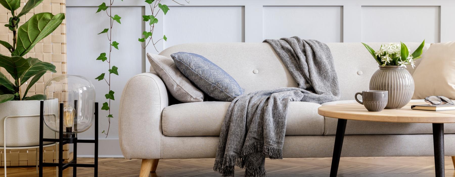 a couch with a table and chairs