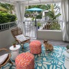 an outdoor lounge area near landscape