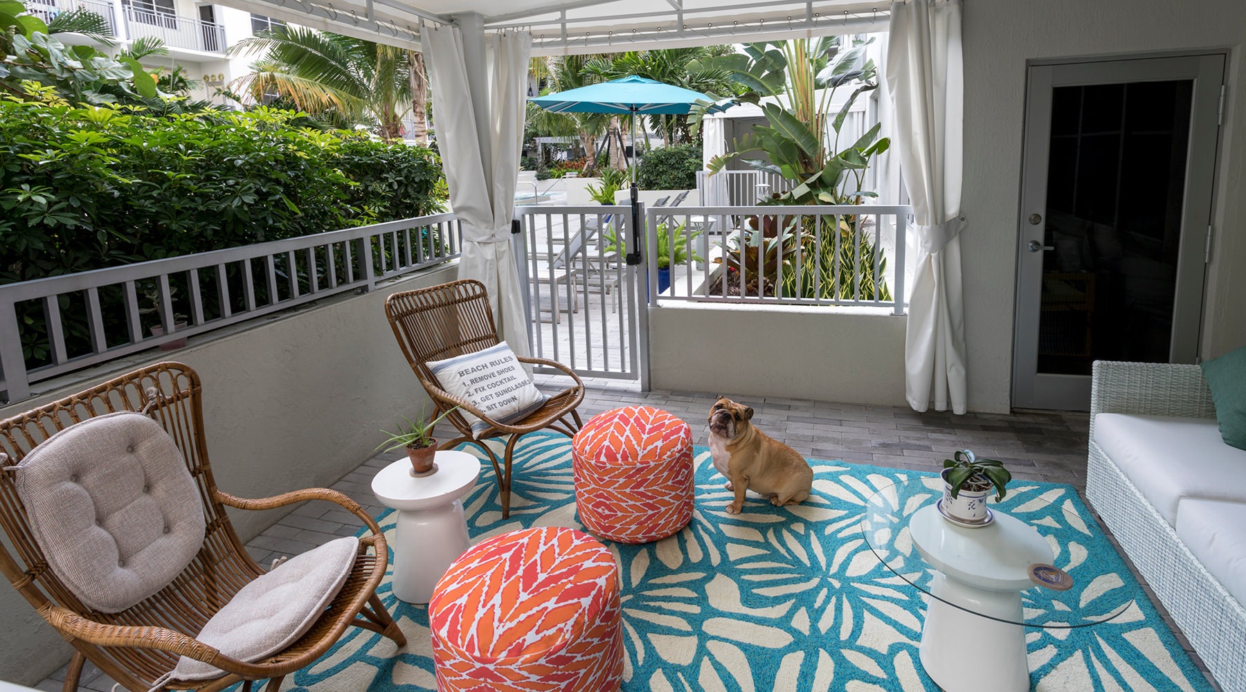 an outdoor lounge area near landscape
