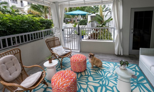an outdoor lounge area near landscape