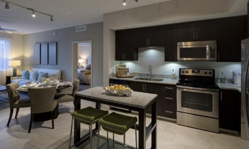 a kitchen with a table and chairs